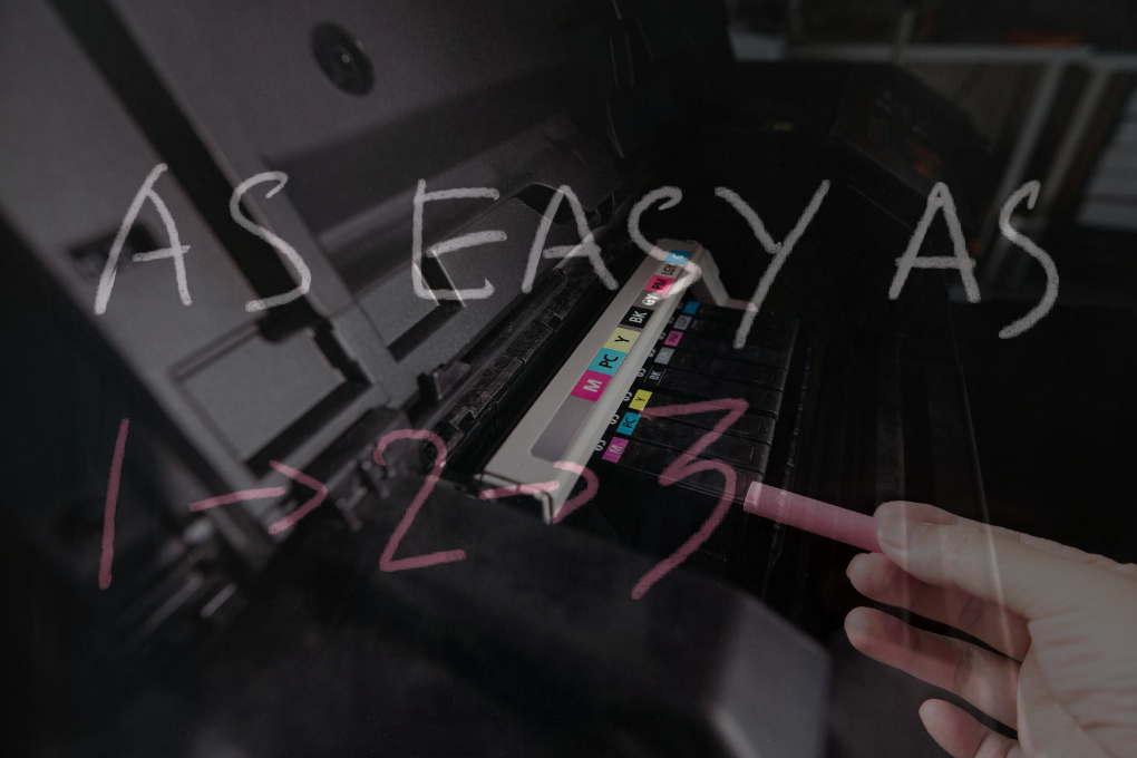Printer tray with chalk text overlay reading “As easy as 1-2-3”
